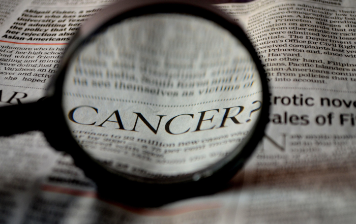 Magnifying glass looking over medical claim